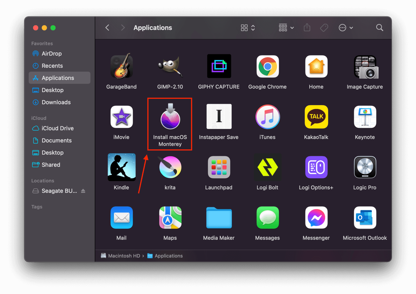 Finder Applications window with a pointer towards the Monterey installer